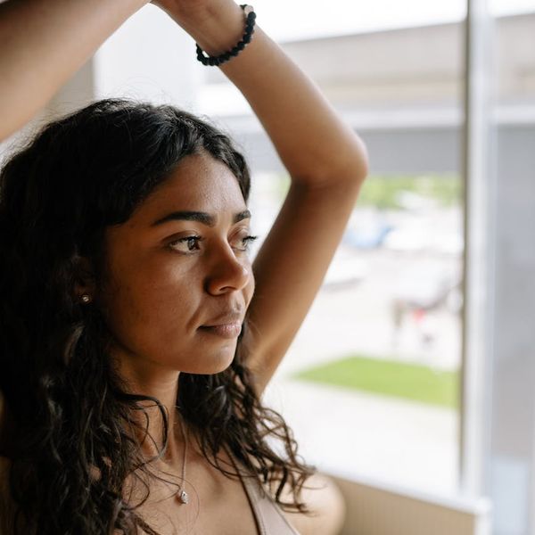 Close-up of a person in a calm, focused state during exercise.